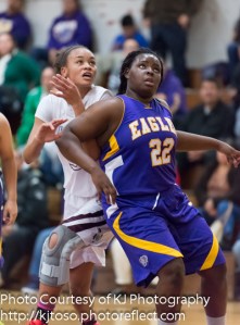 Brackenridge sophomore Marquanique Freeman (22) battles for position inside against Highlands' Jazzmine Jackson (33).