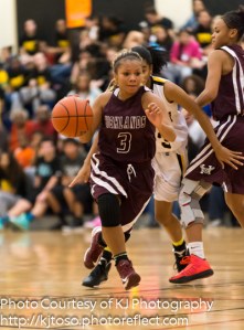 Highlands' Jina Lackey turns the corner against Brennan, thanks to a pick from post Jazmine Jackson.