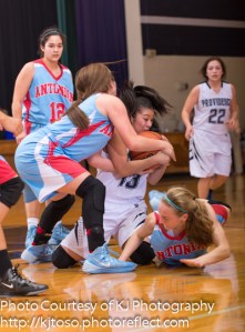 Providence freshman Gabby Gutierrez battles an Antonian defender for possession.