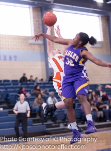 Brackenridge post Tevis Thomas goes for a blocked shot.