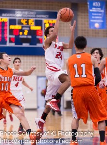 Fox Tech's Angel Lopez (24) drives to the hoop.