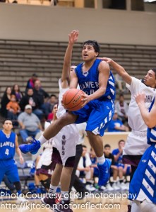 Lanier senior Rodrigo Garcia knifes toward the basket after getting around a pair of defenders.