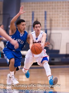 Lanier's Louis Garza (left) applies trademark Voks defensive pressure against Jefferson's Anthony Friere.