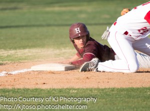 Highlands' Joshua Ortega slides into third base and looks back for the call in a NEISD Tournament game against Taft.