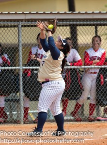 Knights third baseman Melanie Cortinas cradles a foul popup.