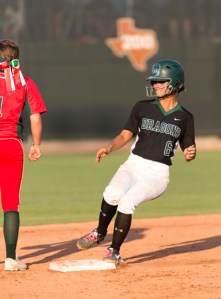 Southwest senior Gabby Flores rounds second base on her fourth-inning RBI double, while a Highlanderfs player awaits the throw from center field.