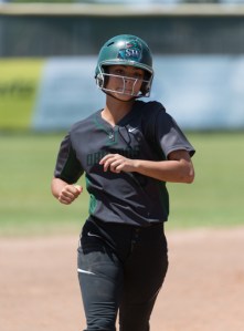 Gabby Flores heads for third base on her way to home plate after hitting a three-run home run.