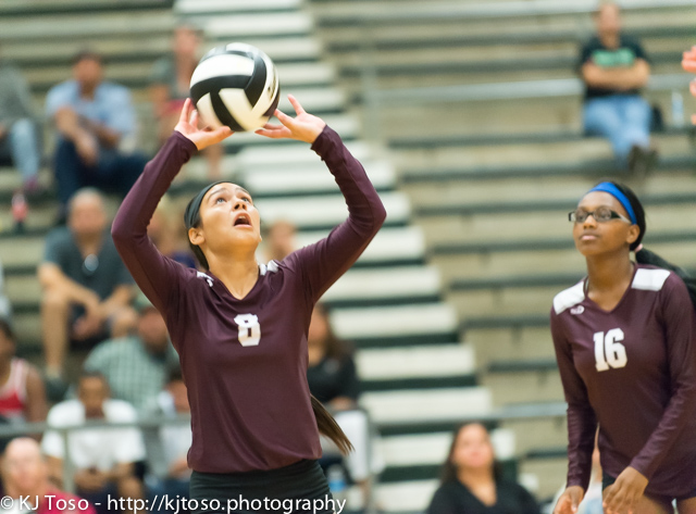 Highlands freshman Jazlyn Losoya prepares to set one of her hitters as Samara Kennedy (16) looks on.