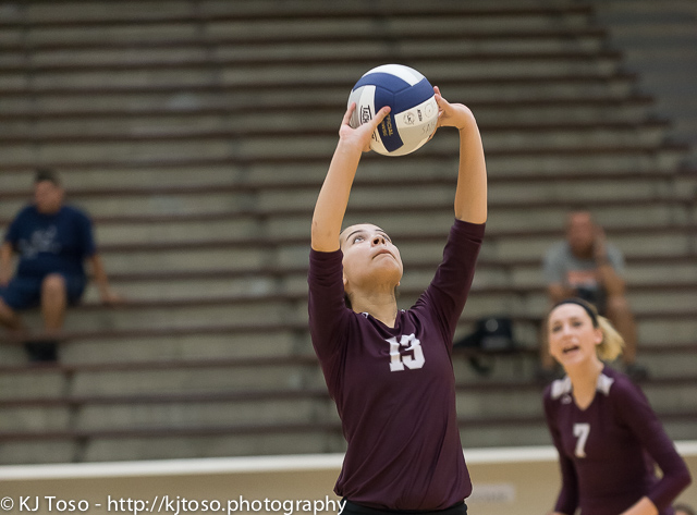 Highlands setter Analisa Garza (13) readies a backset, possibly for Sara Denton (7)