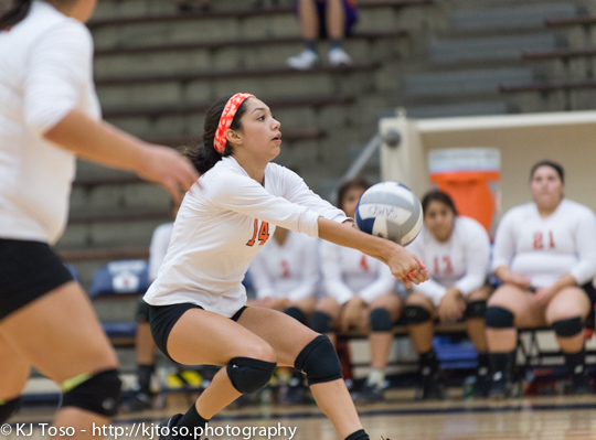 Burbank's Sharriah Martinez makes a dig against Brackenridge.