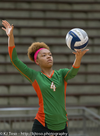 Sam Houston setter Rita Davis serves against Highlands.