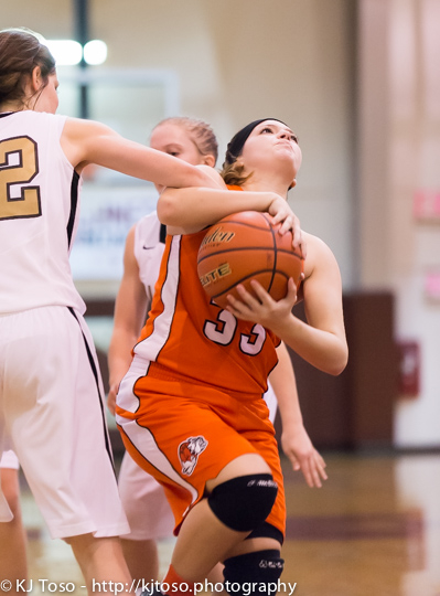 The Bulldogs' Cory Sepulveda hauls down a rebound in traffic against Port Lavaca Calhoun.