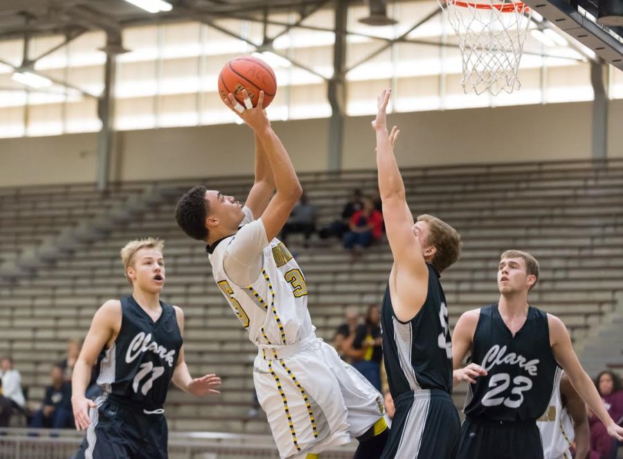 East Central senior Brandon Keno takes a fadeway jumper inside against Clark's Sterling Leopold in an SAISD semifinal game.