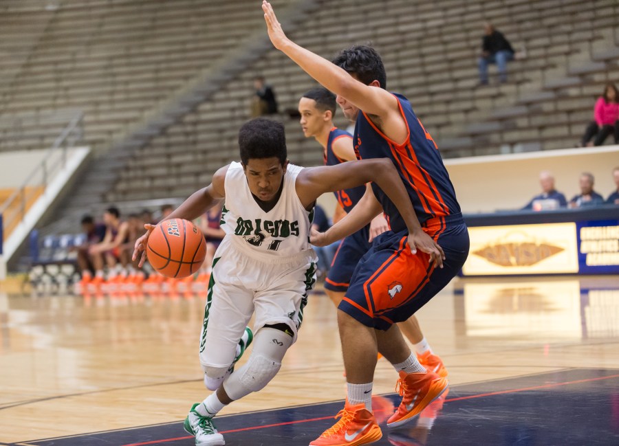 Southwest freshman D'Andre Griffin drives on a Brandeis defender.