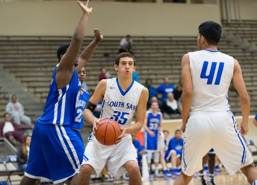 South San's Arthur Rangel (35) assesses the Brahmas' defense while teammate Joseph Zepeda moves in to set a pick. Rangel scored 20 points against Laredo Johnson.