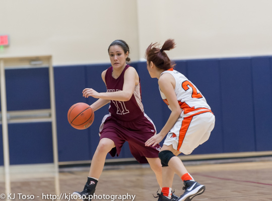 Burbank guard Olivia Cardenas tries to prevent Highlands' Emily Pearce (11) from turning the corner.