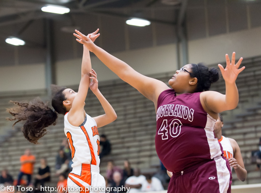 Highlands post Susana Stephens (40) goes after a shot from Burbank guard Jade Moore (10).