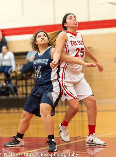 Fox Tech's Mercedes Villarreal (25) and Providence's Natalie Beauchamp (44) battle for rebounding position.