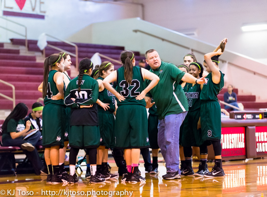 Southwest coach Bill Avey instructs the Dragons during a timeout against Marshall.