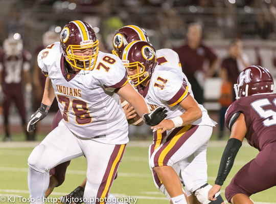 Harlandale lineman Danny Garza (78) looks to set up blocking for Indians back Christian Villarreal (11).