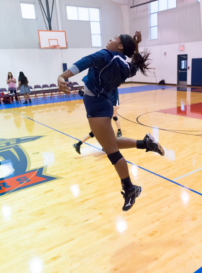 A Cornerstone Christian player hits during warmups.